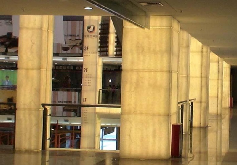 LED light sheet backlighting for translucent stone columns in a commercial interior